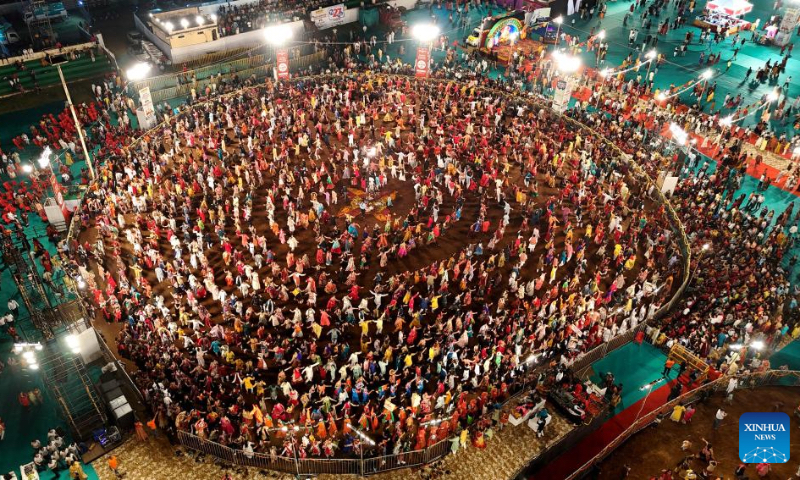 An aerial drone photo shows Hindu devotees performing the Garba dance during the Navratri festival in Bhopal, the capital of India's Madhya Pradesh state, Oct. 5, 2024. (Str/Xinhua)