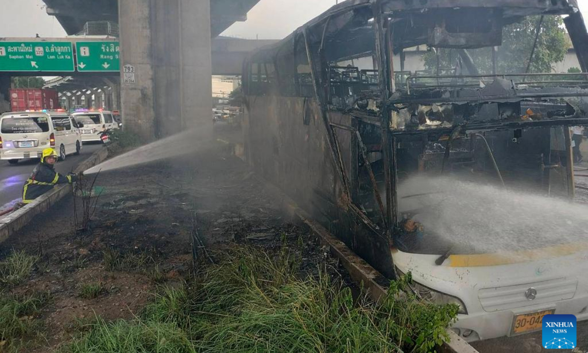 Firefighters try to extinguish a bus fire in Bangkok, Thailand, Oct 1, 2024. Around 25 people were killed and several others missing after a bus carrying passengers on a school trip in Thailand's capital Bangkok caught fire on Tuesday, senior officials said. Photo:Xinhua