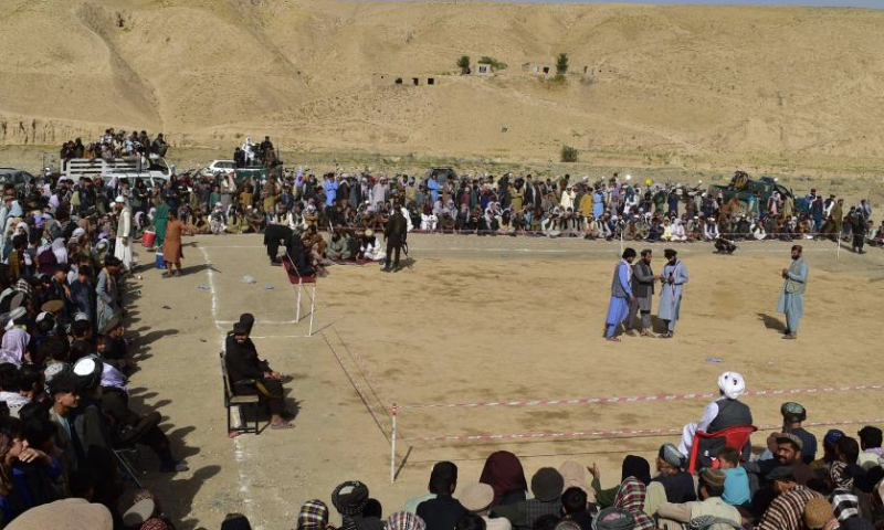 This photo taken on Sept. 8, 2024 shows a general view of a traditional wrestling contest in Nahrin district, north Afghanistan's Baghlan province. Wrestling, a traditional sport with deep roots in Afghan culture, remains popular across the country. In Baghlan province, wrestlers from Baghlan, Kunduz, Takhar and Samangan provinces competed in a thrilling tournament. Dozens of athletes participated, with thousands of spectators gathering to attentively witness this time-honored sport. (Photo by Mehrabuddin Ibrahimi/Xinhua)