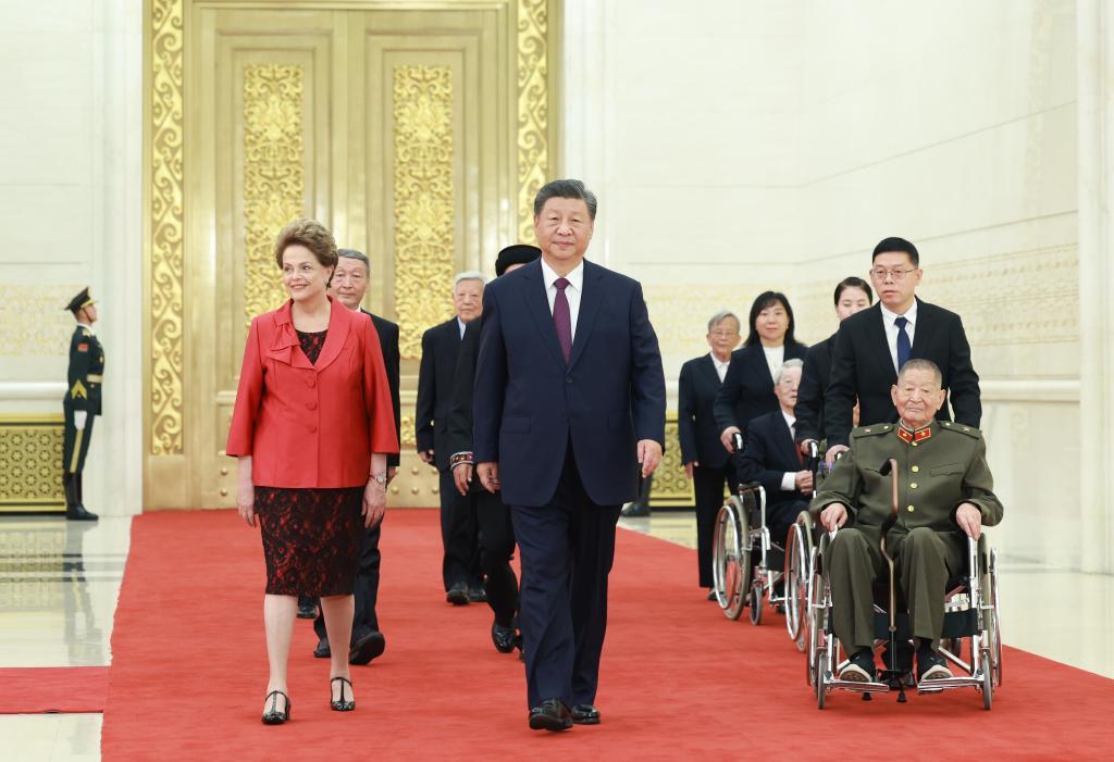 Xi Jinping walks into the venue of the presentation ceremony of the national medals and honorary titles of the People's Republic of China with the recipients at the Great Hall of the People in Beijing, capital of China, Sep 29, 2024. China held a high-profile ceremony on Sunday morning to award the highest state honors ahead of the 75th founding anniversary of the People's Republic of China. Photo:Xinhua