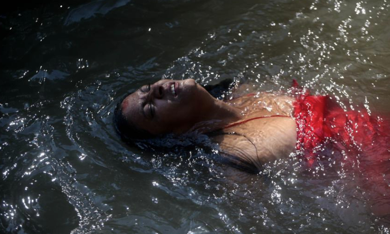 A Hindu woman takes a ritual bath in the Bagmati River during Rishi Panchami festival in Kathmandu, Nepal, Sept. 8, 2024. Rishi Panchami festival marks the end of the three-day Teej festival when women worship Sapta Rishi (Seven Saints) and pray for health for their husband while unmarried women wish for handsome husband and happy conjugal lives. (Photo by Sulav Shrestha/Xinhua)