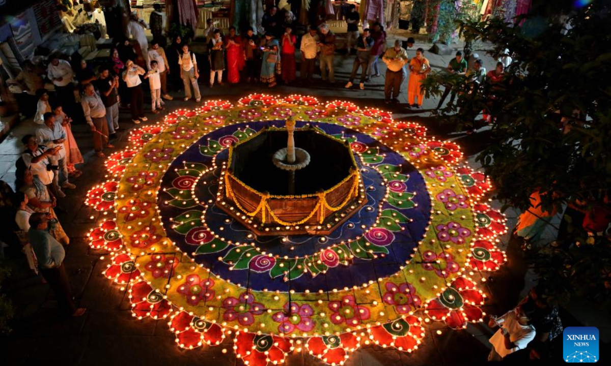 People light oil lamps for the upcoming Diwali, or the Hindu festival of lights, in Bhopal, the capital of India's Madhya Pradesh state, Oct. 26, 2024. (Photo: Xinhua)