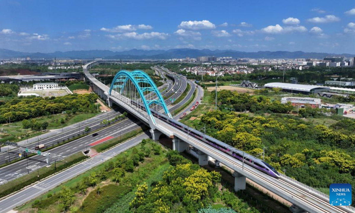 An aerial drone photo taken on Sep 6, 2024 shows a bullet train running along the Hangzhou-Wenzhou high-speed railway in Xianju County, east China's Zhejiang Province. Photo:Xinhua