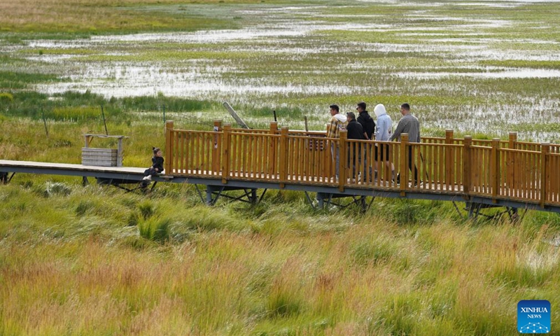 Tourists view the scenery of Gahai Lake wetland in the Gahai-Zecha National Nature Reserve in Gannan Tibetan Autonomous Prefecture, northwest China's Gansu Province, Sept. 4, 2024. (Photo: Xinhua)