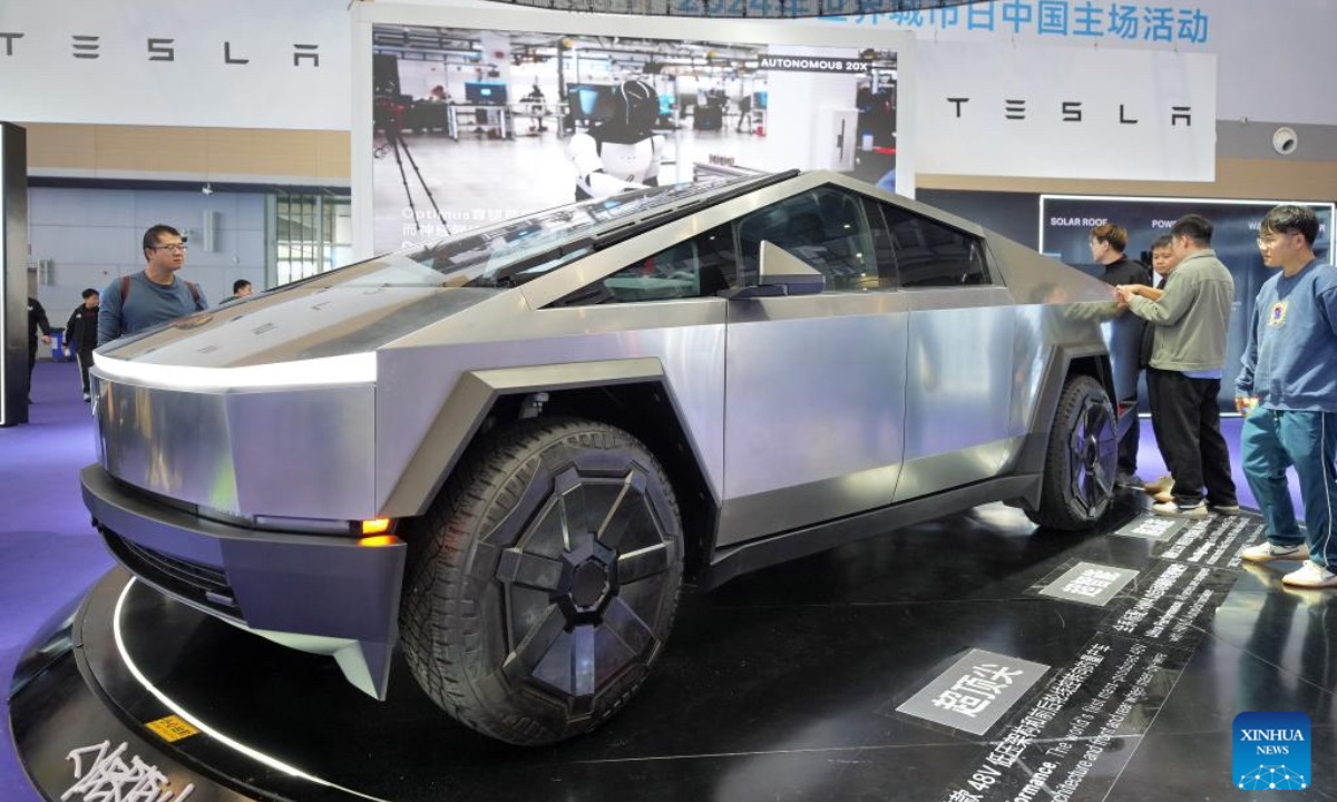 People look at a cybertruck of Tesla at an exhibition of the 2024 World Cities Day China Observance in Weihai, east China's Shandong Province, Oct. 26, 2024. More than 2000 delegates from over 30 countries and regions attended the event. (Photo: Xinhua)