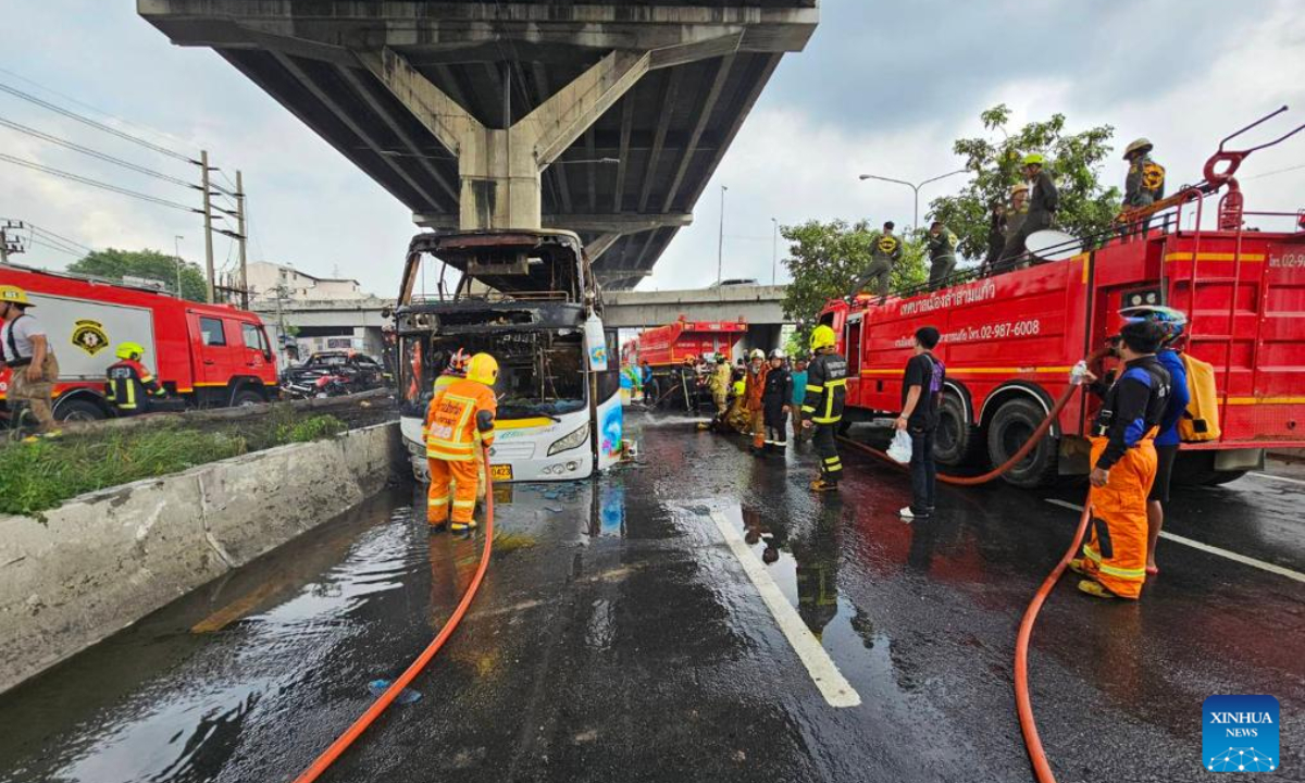 Firefighters work on the site of a bus fire in Bangkok, Thailand, Oct. 1, 2024. Around 25 people were killed and several others missing after a bus carrying passengers on a school trip in Thailand's capital Bangkok caught fire on Tuesday, senior officials said. Photo:Xinhua