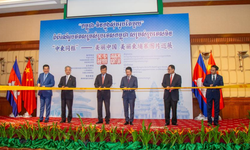 Cambodian and Chinese officials cut the ribbon to inaugurate a joint Cambodia-China photo exhibition tour in Siem Reap province, Cambodia on Sept. 8, 2024. A launching ceremony for the Beautiful Cambodia, Beautiful China photo exhibition tour was held here in northwest Cambodia's cultural province on Sunday, captivating scores of visitors.

A total of 66 exquisite photos, 33 each from Cambodia and China, featuring natural scenery, historical heritage, cultural splendor, artistic diversity, urban development, and modern lifestyles are on display at the event. (Photo by Sao Khuth/Xinhua)