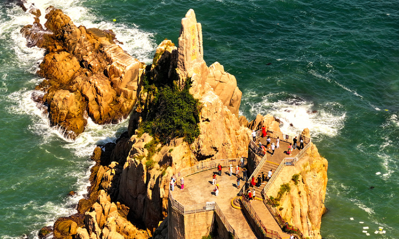 Tourists take in the seaside scenery at Chengshantou Scenic Area, Rongcheng, East China’s Shandong Province, on September 11, 2024. Photo: VCG