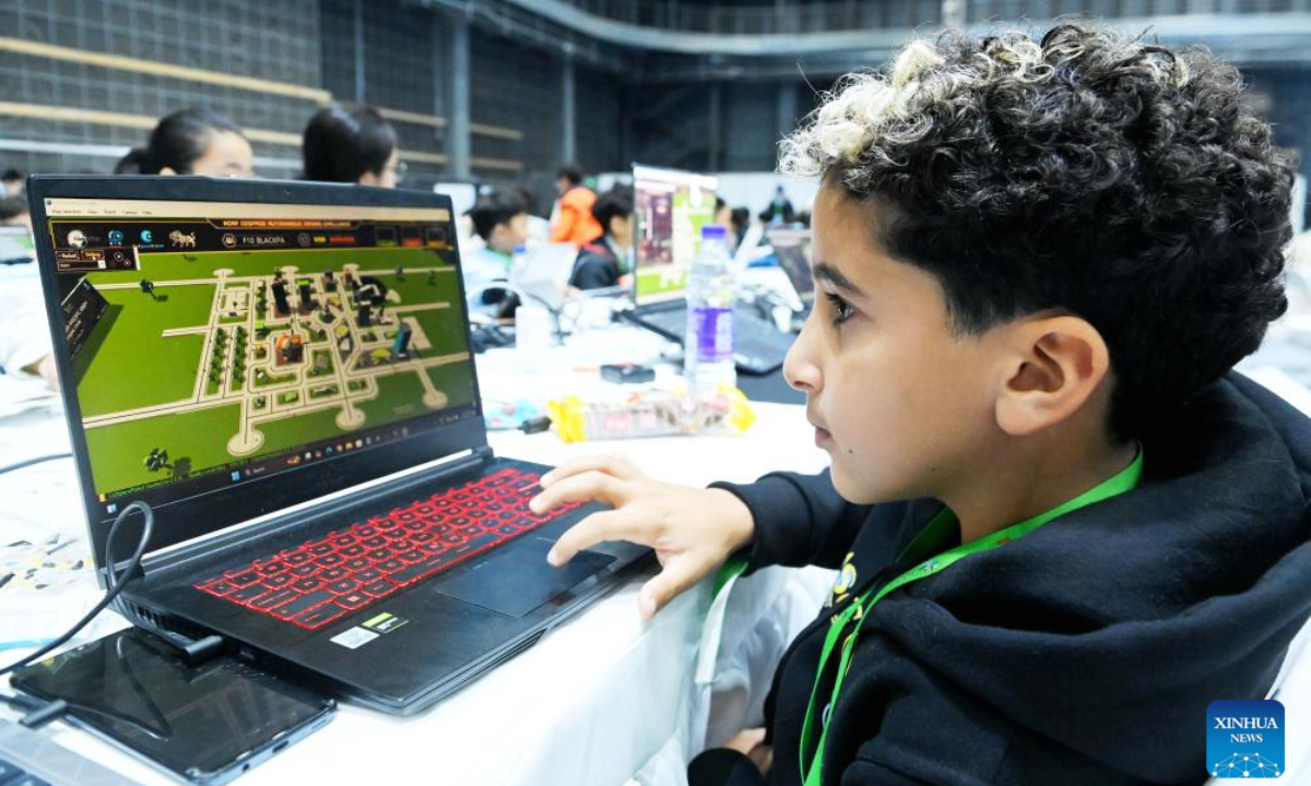 A competitor takes part in the RoboCup Asia-Pacific 2024 in Qingdao, east China's Shandong Province, Oct. 26, 2024. More than 200 teams from over 20 countries and regions participated in this competition. (Photo: Xinhua)