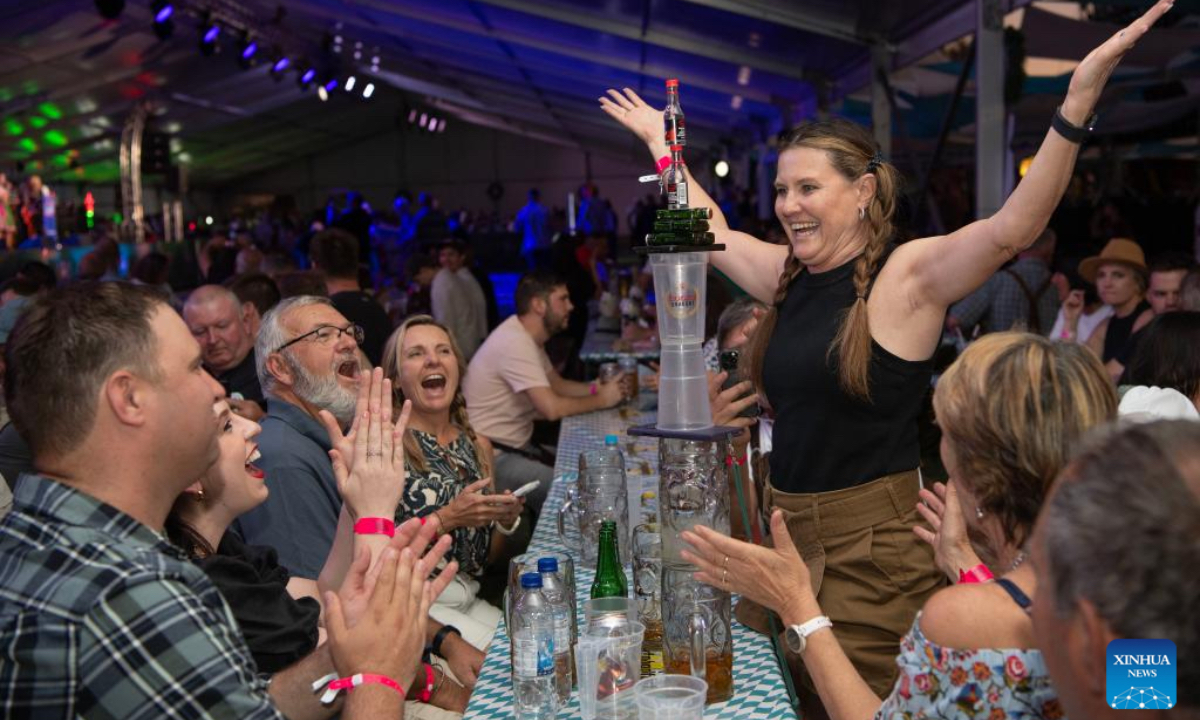 People enjoy a game at the Windhoek Oktoberfest in Windhoek, Namibia, Oct. 25, 2024. The 64th edition of the Windhoek Oktoberfest kicked off on Friday in the Namibian capital of Windhoek. (Photo: Xinhua)