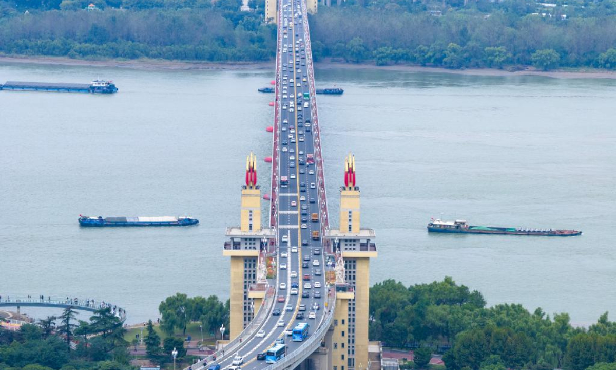 An aerial drone photo taken on Oct 1, 2024 shows the traffic on the Nanjing Yangtze River Bridge in Nanjing, east China's Jiangsu Province. Tuesday marks the first day of China's National Day holiday. China is expected to see 175 million railway trips during the 10-day travel rush, which runs from Sep 29 to Oct 8, according to China State Railway Group Co., Ltd. Photo:Xinhua