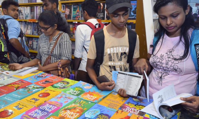 People read books at the Colombo International Book Fair in Colombo, Sri Lanka, Sept. 27, 2024. The Colombo International Book Fair is held from Sept. 27 to Oct. 6. (Photo by Ajith Perera/Xinhua)