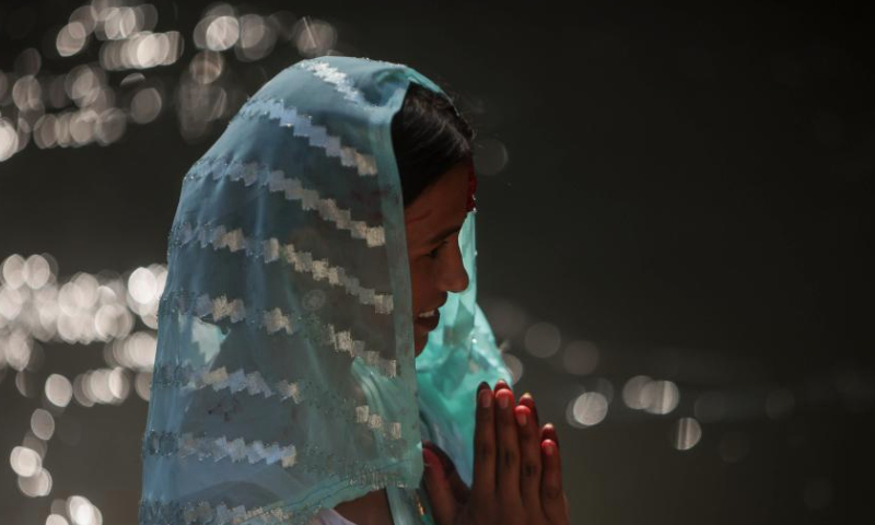 A Hindu woman offers a prayer in the Bagmati River during Rishi Panchami festival in Kathmandu, Nepal, Sept. 8, 2024. Rishi Panchami festival marks the end of the three-day Teej festival when women worship Sapta Rishi (Seven Saints) and pray for health for their husband while unmarried women wish for handsome husband and happy conjugal lives. (Photo by Sulav Shrestha/Xinhua)