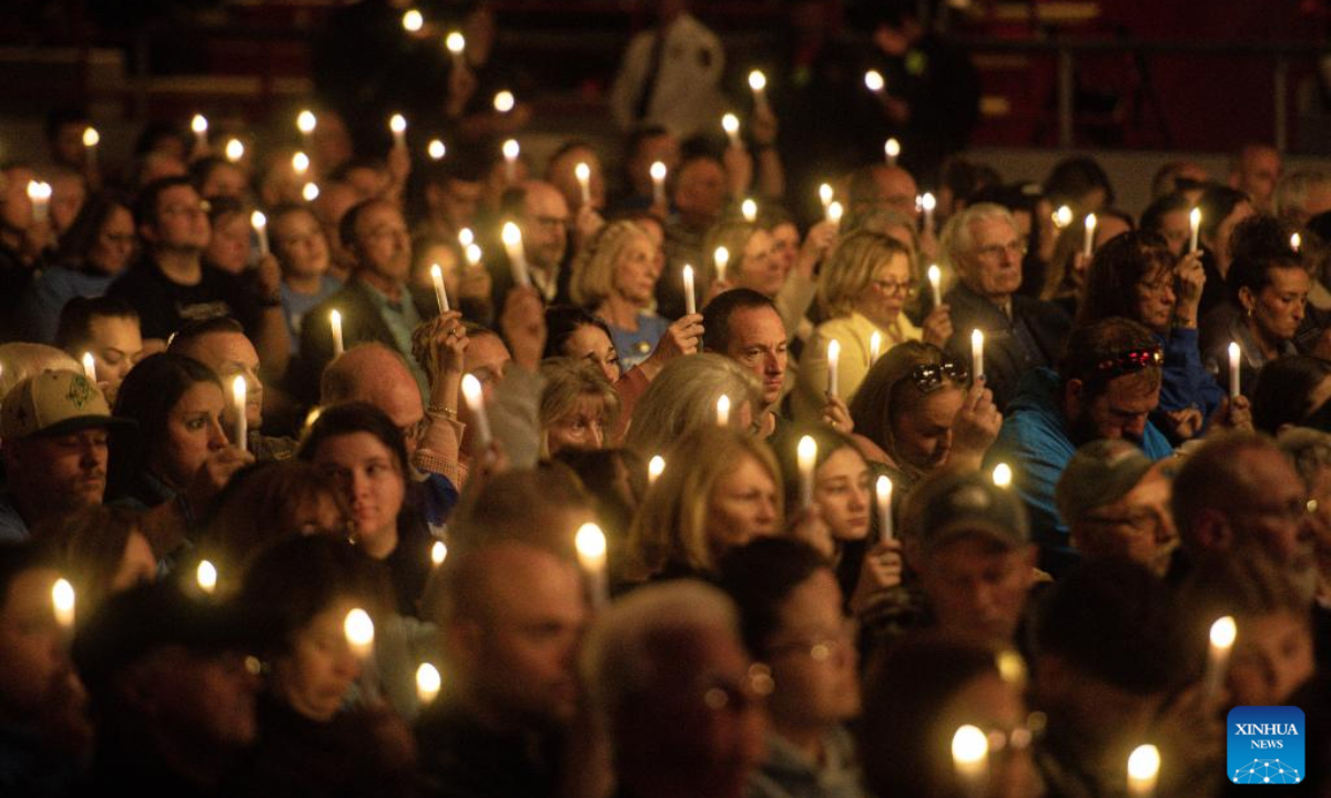 A candlelight vigil is held to mourn Lewiston shooting victims in Lewiston, Maine, the United States on Oct. 25, 2024. This Friday marks the one year anniversary of the mass shooting in Lewison back in 2023. As many as 18 people were killed and 13 injured in the mass shooting. (Photo: Xinhua)