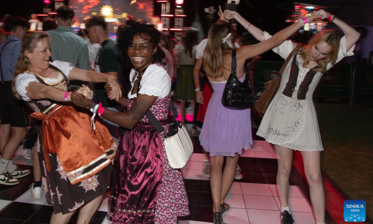 People dance at the Windhoek Oktoberfest in Windhoek, Namibia, Oct. 25, 2024. The 64th edition of the Windhoek Oktoberfest kicked off on Friday in the Namibian capital of Windhoek. (Photo: Xinhua)