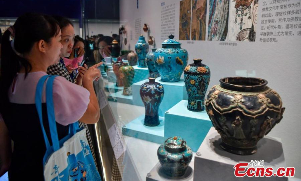 People visit an exhibition featuring relics retrieved from two ancient shipwrecks discovered in the South China Sea at the China (Hainan) Museum of the South China Sea in Qionghai, south China's Hainan Province, Sep 27, 2024. Photo:China News Service