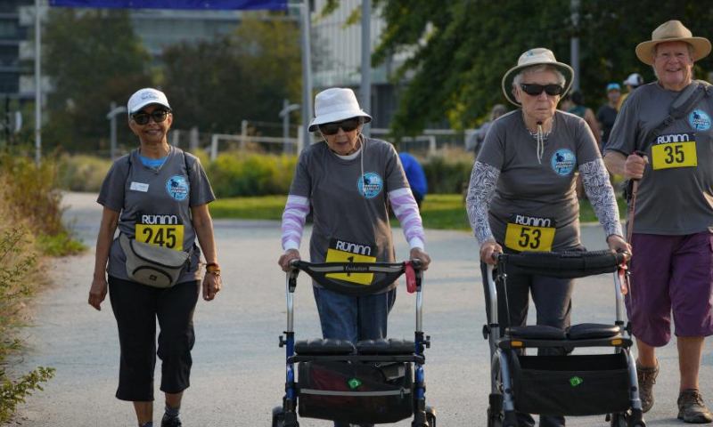 Seniors take part in the Forever Young 8K Run in Richmond, British Columbia, Canada, Sept. 8, 2024.

Hundreds of senior runners, joggers, and walkers took part in the Forever Young 8K Run here on Sunday to celebrate the 10th anniversary of the event. (Photo by Liang Sen/Xinhua)