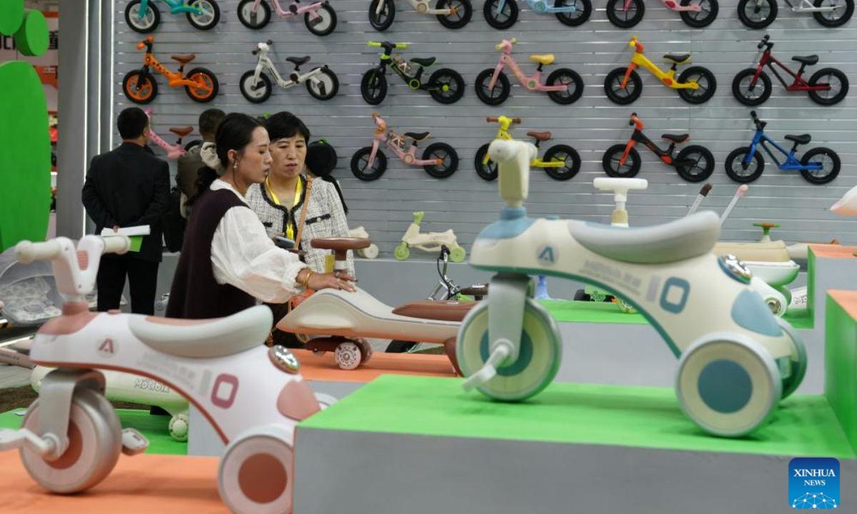 Merchants visit the 18th International Bicycles, Baby Strollers and Toys Fair in Pingxiang County, north China's Hebei Province, Oct. 26, 2024. The fair opened here on Saturday, with more than 3,000 booths and attracting merchants from over 80 countries and regions. Pingxiang of Hebei Province is renowned for its industry of bicycles, baby strollers and toys. (Photo: Xinhua)