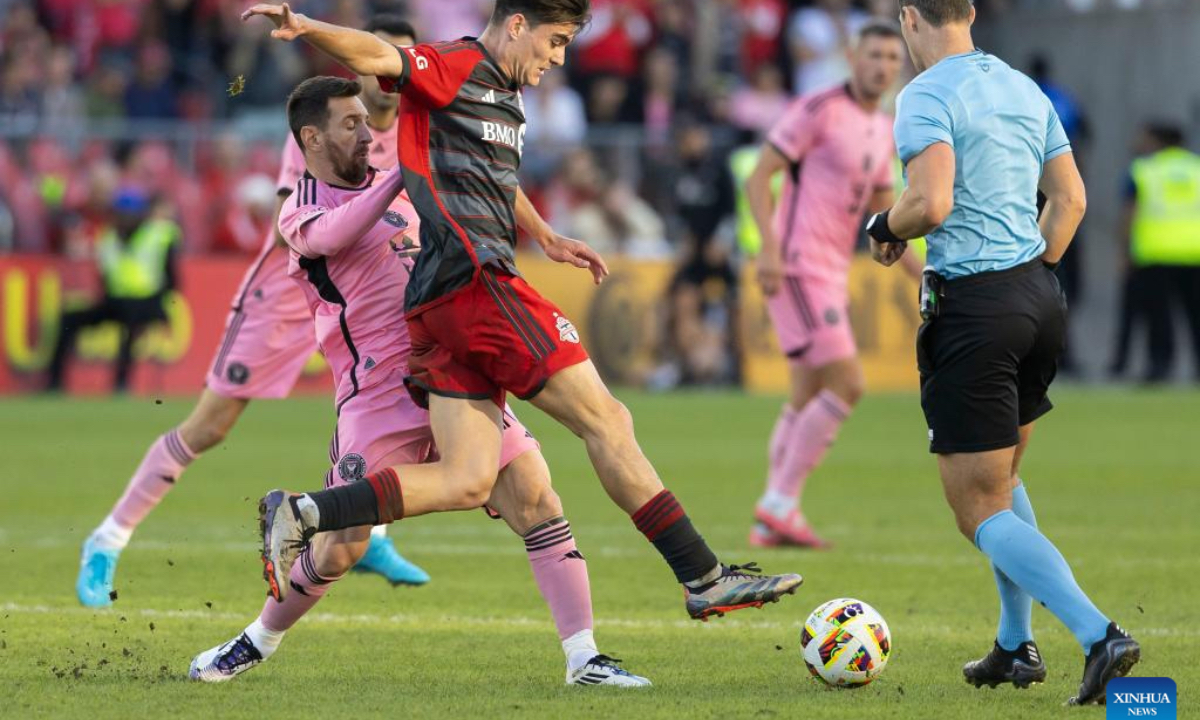 Lionel Messi (L) of Inter Miami CF vies with Alonso Coello of Toronto FC during the 2024 Major League Soccer(MLS) match between Toronto FC and Inter Miami CF at BMO Field in Toronto, Canada, on Oct. 5, 2024. (Photo: Xinhua)