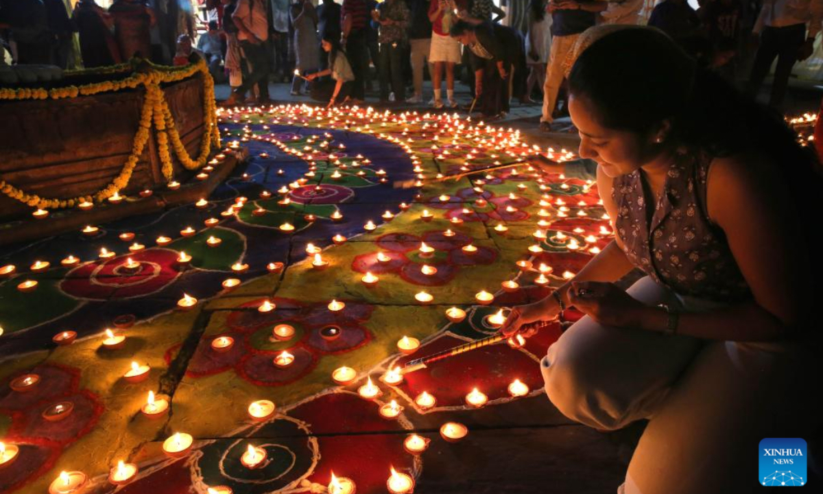 People light oil lamps for the upcoming Diwali, or the Hindu festival of lights, in Bhopal, the capital of India's Madhya Pradesh state, Oct. 26, 2024. (Photo: Xinhua)