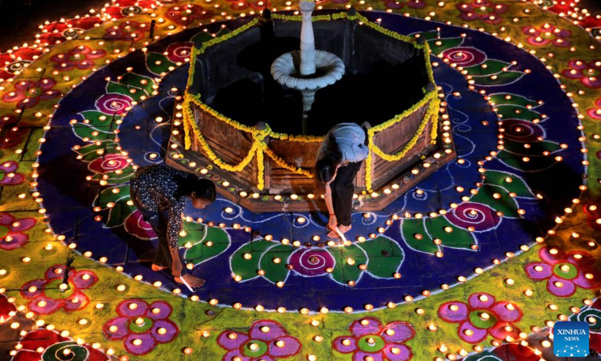 People light oil lamps for the upcoming Diwali, or the Hindu festival of lights, in Bhopal, the capital of India's Madhya Pradesh state, Oct. 26, 2024. (Photo: Xinhua)