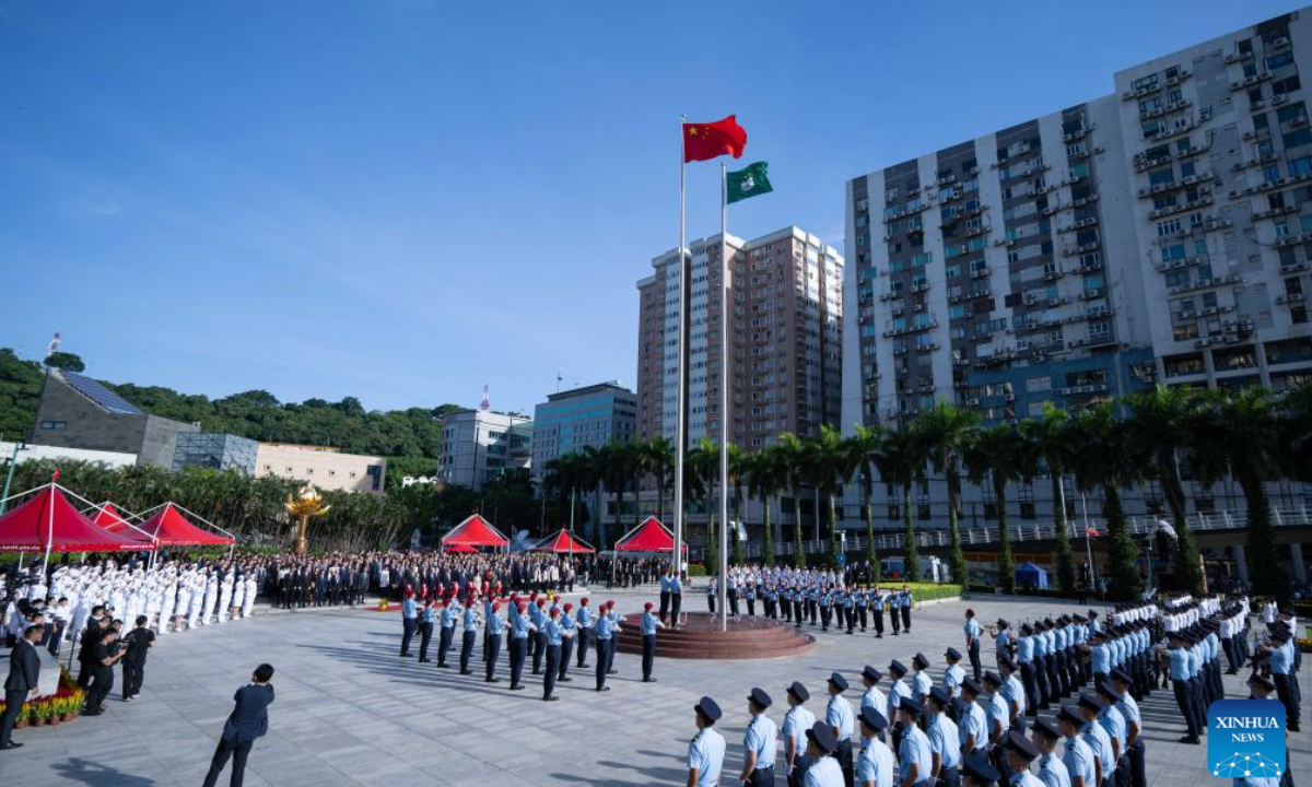 A flag-raising ceremony marking the 75th anniversary of the founding of the People's Republic of China is held in Macao, south China, Oct 1, 2024. Photo:Xinhua