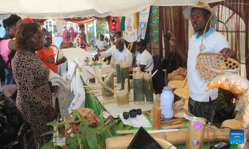 Edmond Machoki (1st R) introduces bamboo products to local people at an exhibition in Nyeri County, central Kenya, Sept. 13, 2024. (Photo by Robert Manyara/Xinhua)