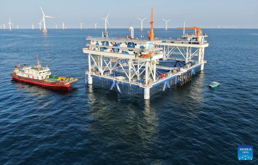 An aerial drone photo taken on Sept. 2, 2024 shows China General Nuclear Power Corporation (CGN)'s Fuxi No. 1 wind power-fishery integrated project in Shanwei, south China's Guangdong Province. Using green energy as its power supply, the marine ranch project started its operation in Shanwei on Sept. 4. It is expected to produce 900 tonnes of high-quality marine fish annually. (Photo: Xinhua)