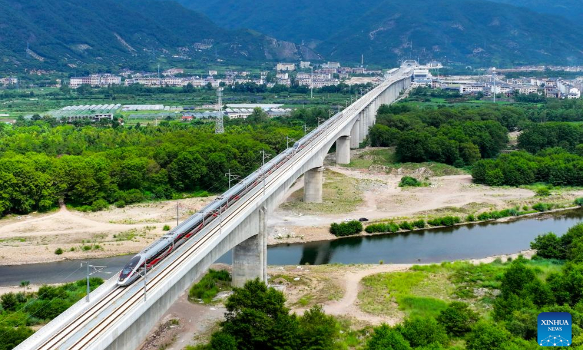 An aerial drone photo taken on Sep 6, 2024 shows a bullet train running along the Hangzhou-Wenzhou high-speed railway in Xianju County, east China's Zhejiang Province. Photo:Xinhua