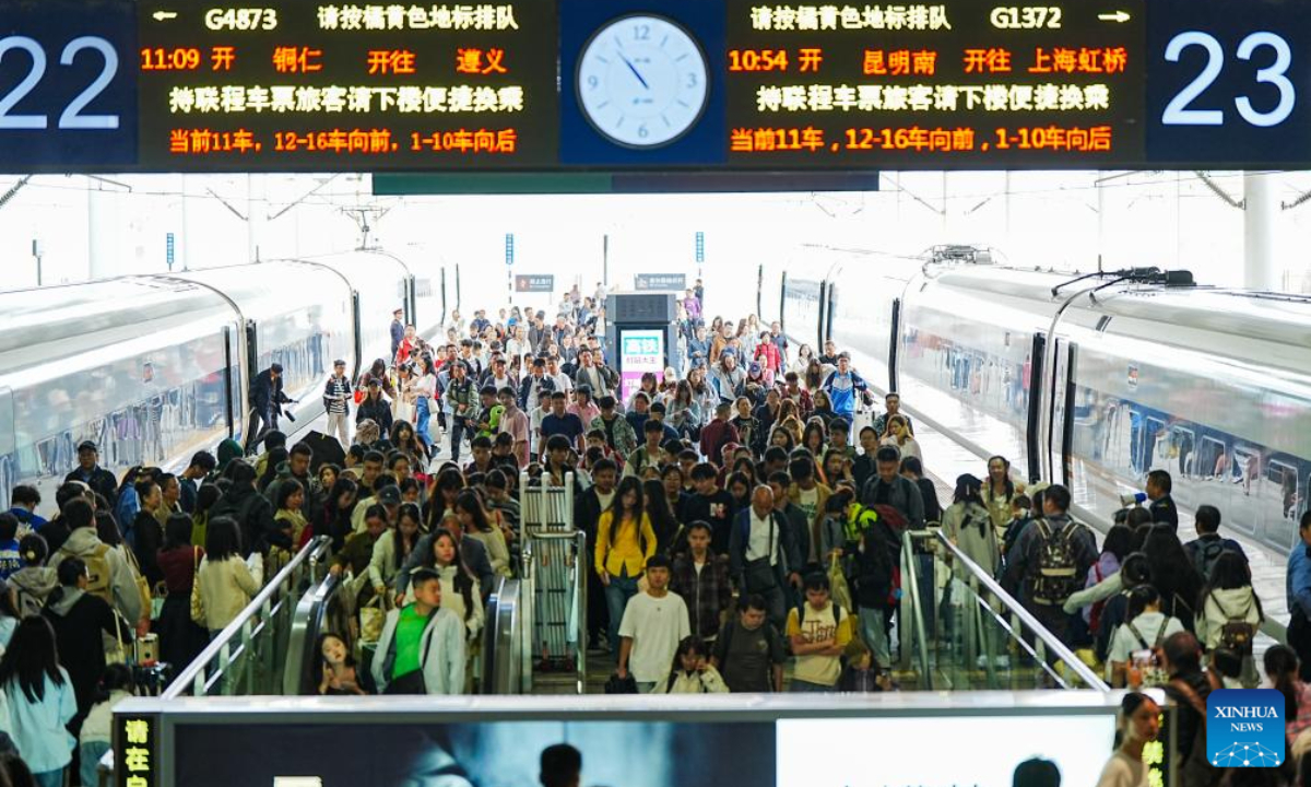 Passengers get off trains at Guiyang North Railway Station in Guiyang, southwest China's Guizhou Province, Oct 1, 2024. Tuesday marks the first day of China's National Day holiday. China is expected to see 175 million railway trips during the 10-day travel rush, which runs from Sep 29 to Oct 8, according to China State Railway Group Co., Ltd. Photo:Xinhua