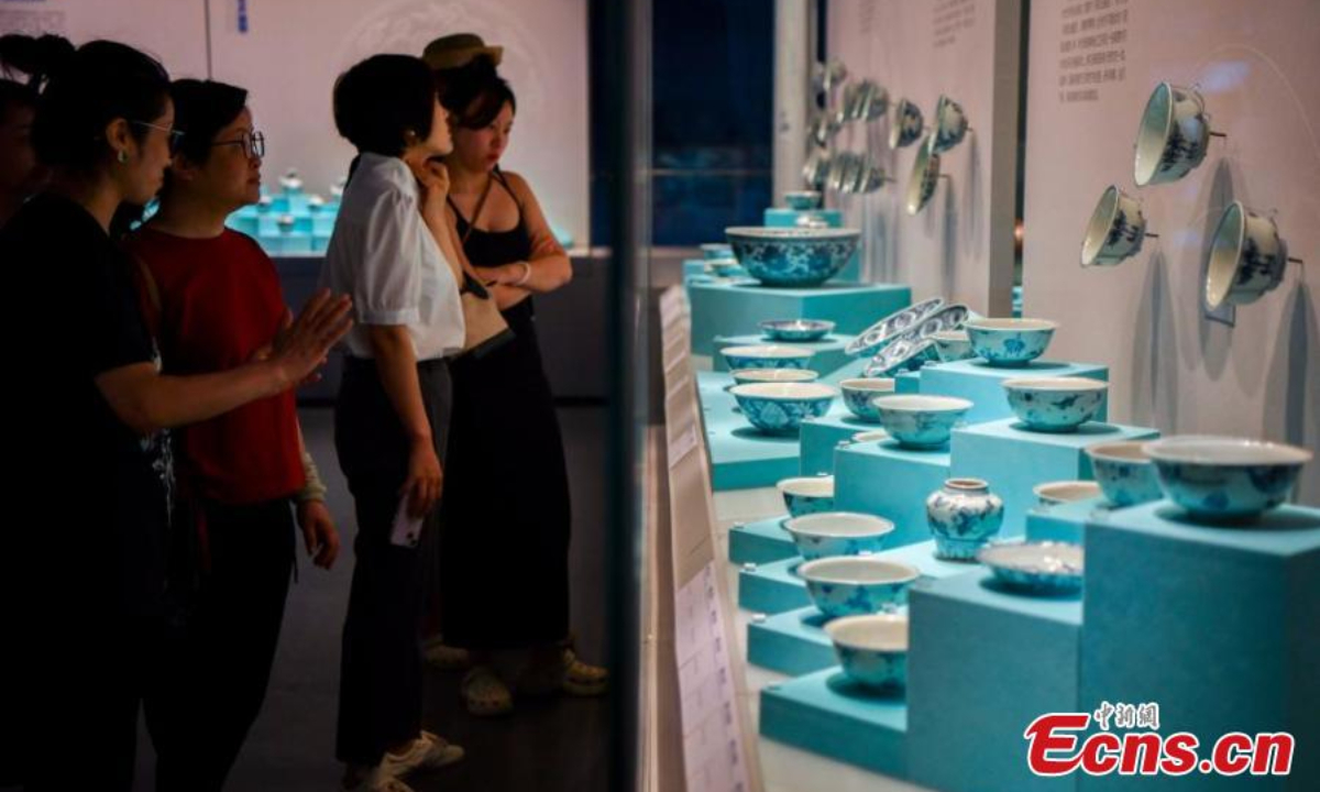 People visit an exhibition featuring relics retrieved from two ancient shipwrecks discovered in the South China Sea at the China (Hainan) Museum of the South China Sea in Qionghai, south China's Hainan Province, Sep 27, 2024. Photo:China News Service