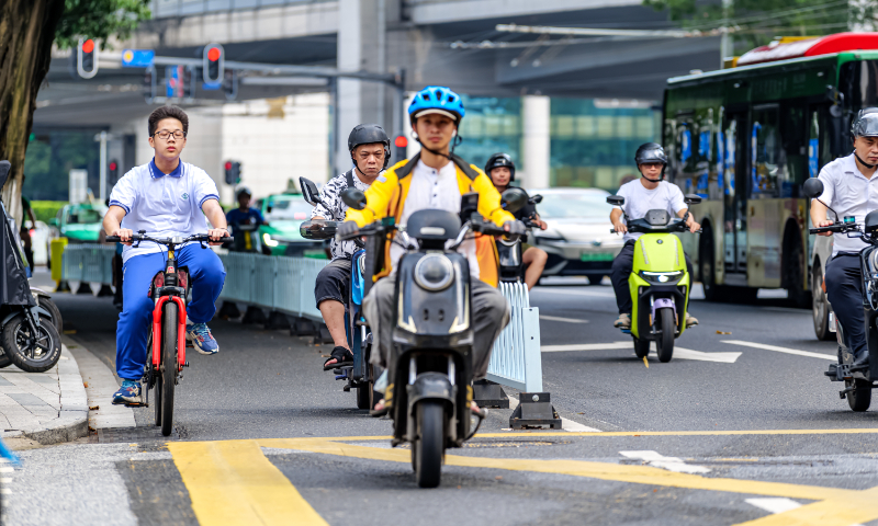 Residents ride electric bicycles in Guangzhou, South China's Guangdong Province, on September 11, 2024. Photo: VCG