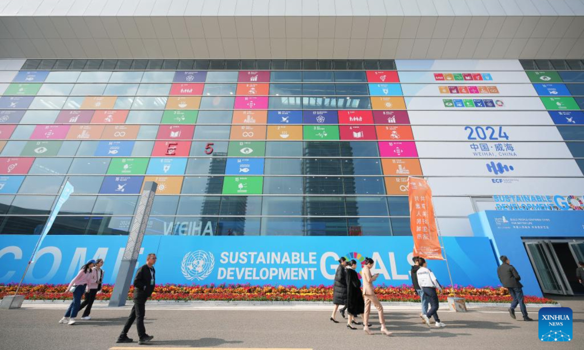 People visit an exhibition of the 2024 World Cities Day China Observance in Weihai, east China's Shandong Province, Oct. 26, 2024. More than 2000 delegates from over 30 countries and regions attended the event. (Photo: Xinhua)