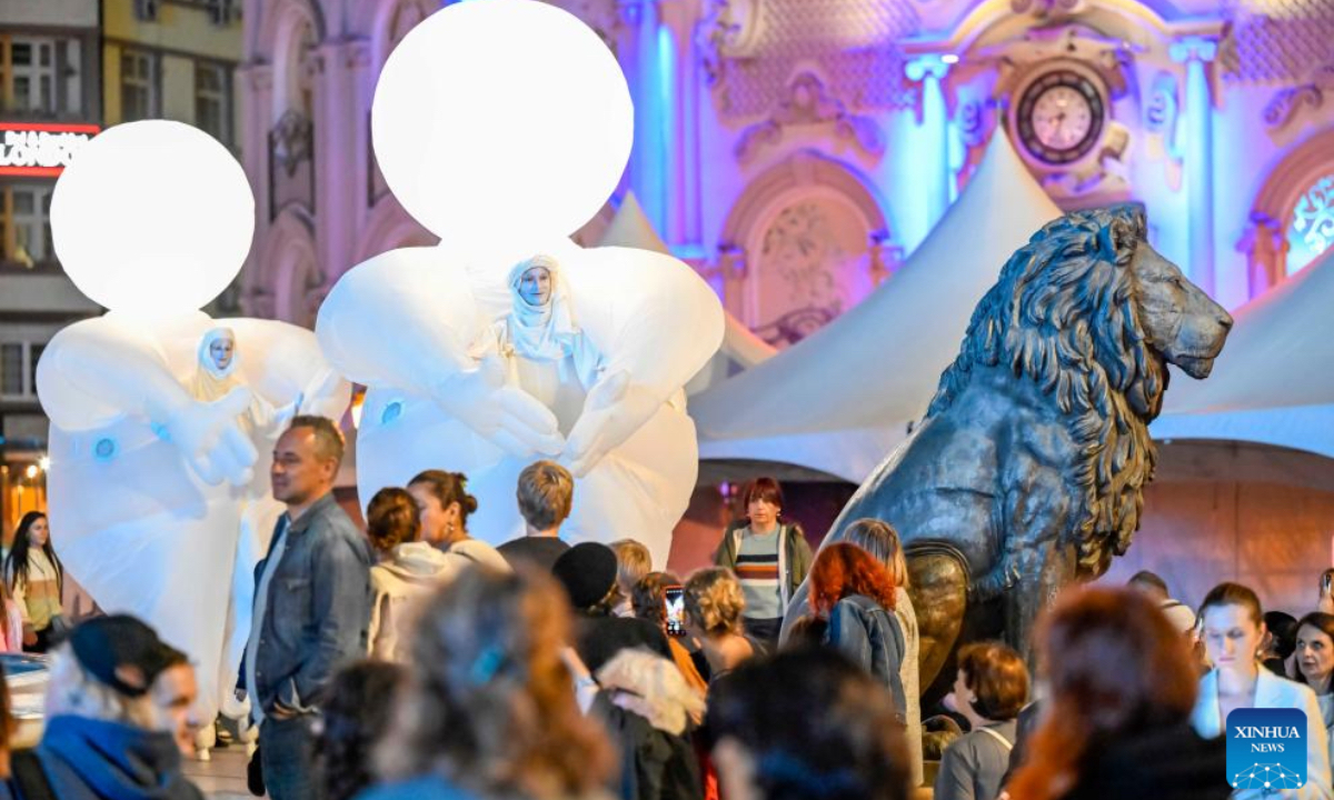 Members of French theater troupe Compagnie des Quidams perform the play 