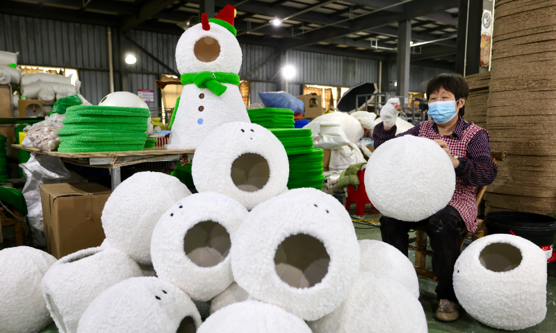 A worker makes toys for pets in a workshop in Wenqiao township, East China's Zhejiang Province, on October 31, 2024. Industry data show that from January to August, China exported 283,200 tons of pet products, an increase of 22.1 percent year-on-year, with the export value amounting to $1.181 billion, an increase of 2.4 percent. Photo: VCG