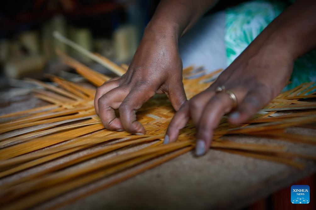 Fikirte Gebre works on bamboo products in the Green Golden Bamboo workshop in Addis Ababa, Ethiopia, Aug. 10, 2024. (Photo: Xinhua)