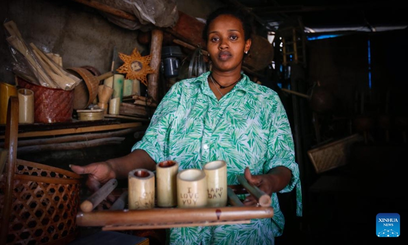 Fikirte Gebre displays finished bamboo products in the Green Golden Bamboo workshop in Addis Ababa, Ethiopia, Aug. 10, 2024. (Photo: Xinhua)