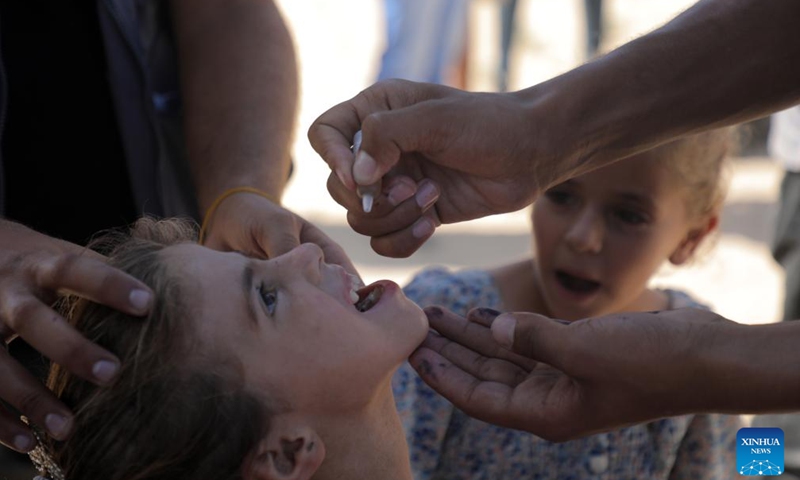 A child receives a dose of the polio vaccine in Khan Younis city in the southern Gaza Strip, on Sept. 5, 2024. The second phase of administering polio vaccinations to children under 10 years of age got underway in Gaza's southern zone, UN humanitarians said on Thursday. (Photo: Xinhua)