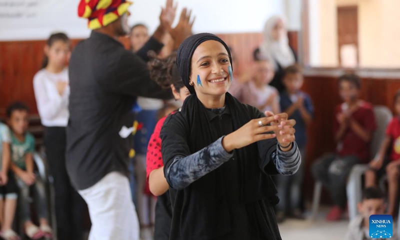 Local children participate in an entertainment activity in the Al-Maghazi refugee camp, central Gaza Strip, on Sept. 5, 2024. Palestinian volunteers on Thursday launched several entertainment activities for children in Gaza to release their psychological pressure that resulted from the ongoing Israel-Hamas conflict. (Photo: Xinhua)