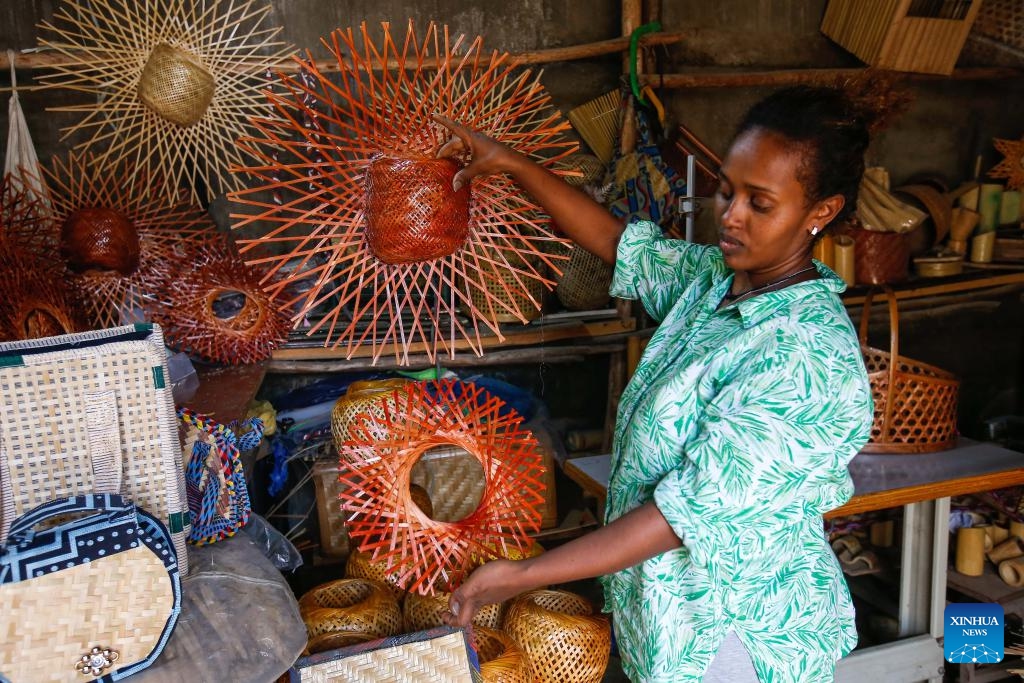 Fikirte Gebre displays finished bamboo products in the Green Golden Bamboo workshop in Addis Ababa, Ethiopia, Aug. 10, 2024. (Photo: Xinhua)