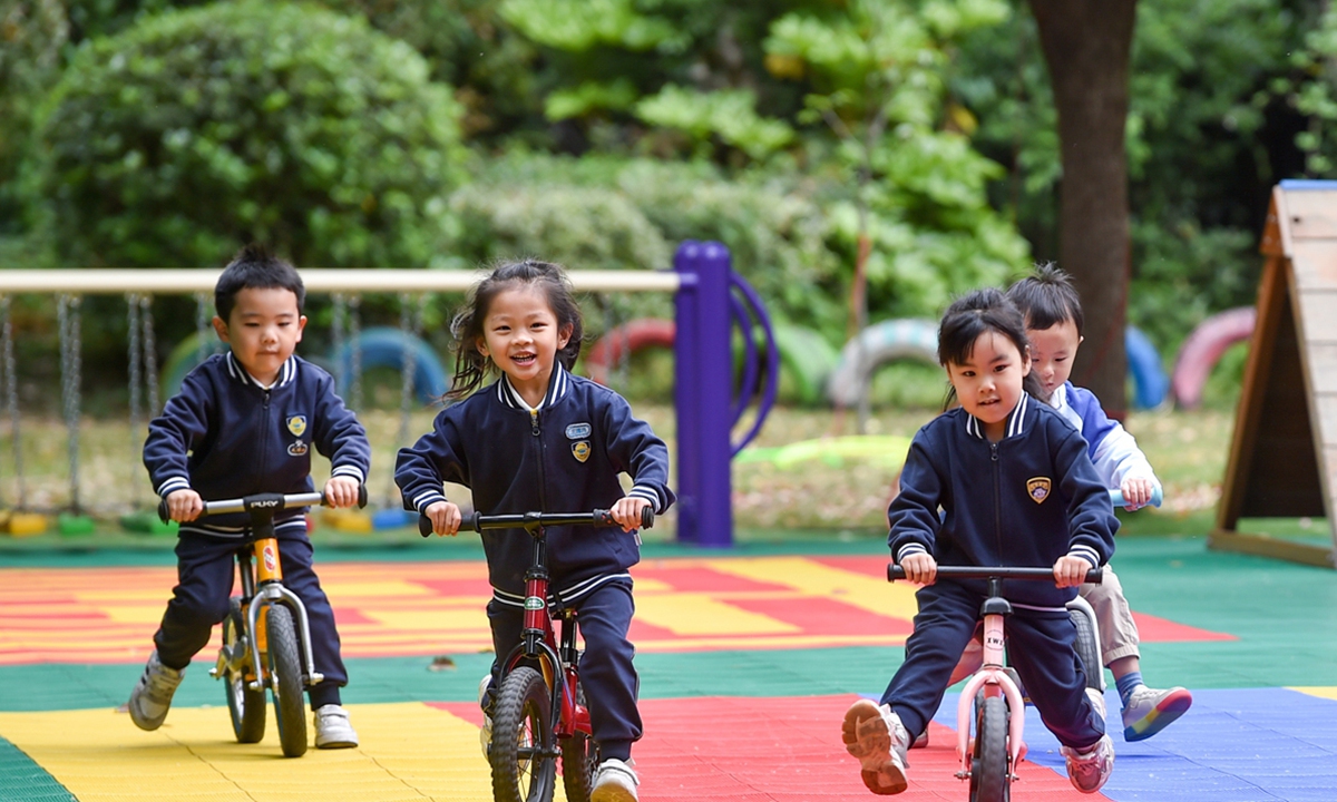 Children ride hoverboards at a kindergarten in Nanjing, capital of East China's Jiangsu Province on April 21, 2023. Photo: VCG