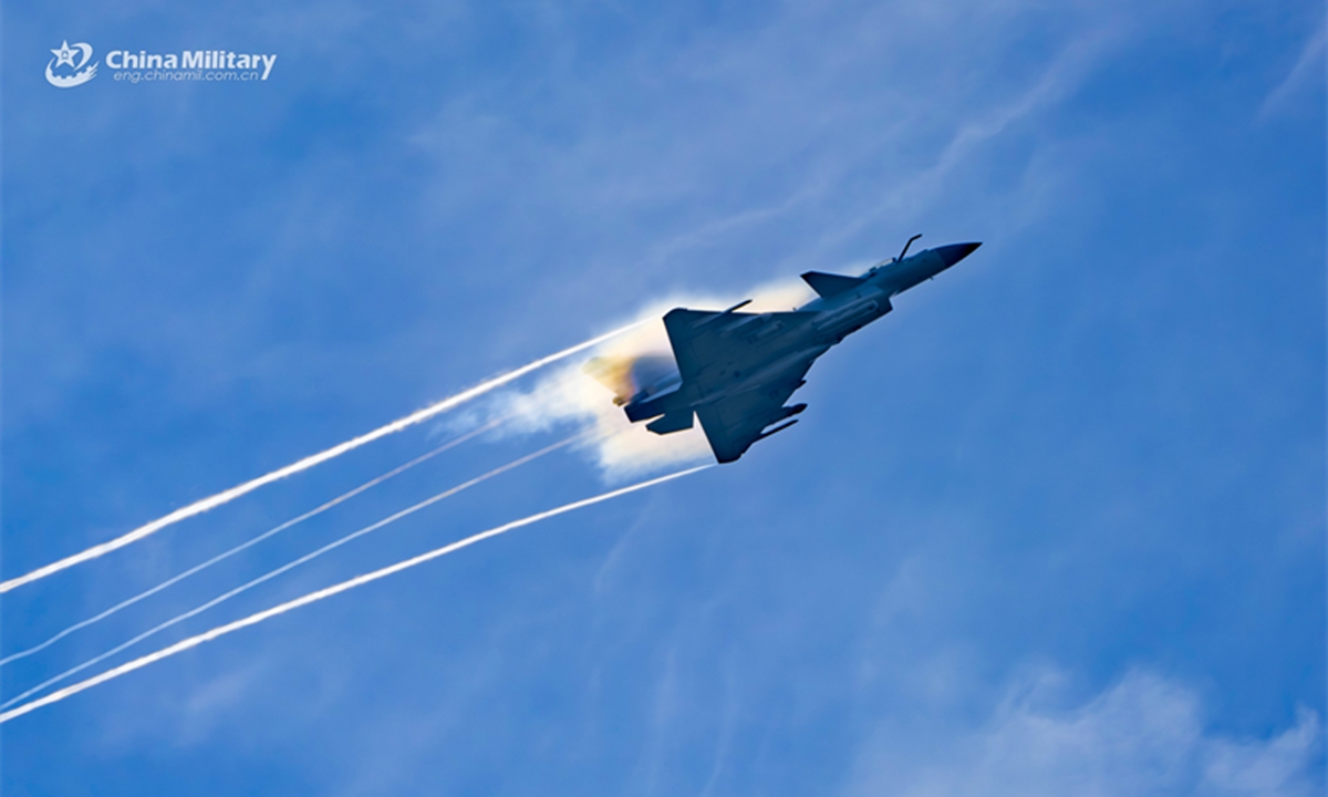 Fighter jet attached to an aviation brigade under the Chinese PLA Southern Theater Command speeds up during a round-the-clock flight training exercise on August 7, 2024. (eng.chinamil.com.cn/Photo by Hou Kaiwen)