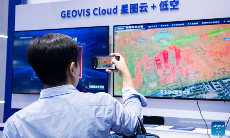 A visitor takes photos of the digital low-altitude brain product used for urban airspace management at an exhibition of the 2024 Low Altitude Economic Development Conference in Wuhu, east China's Anhui Province, Sept. 6, 2024. Photo: Xinhua