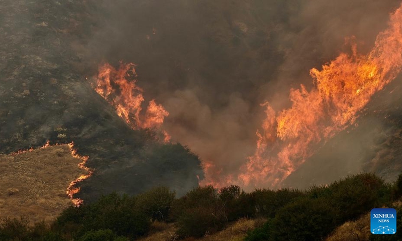 This photo taken on Sept. 7, 2024 shows a wildfire in San Bernardino County, California, the United States. An unrelenting heat wave has engulfed Southern California this week with temperatures in some areas reaching record highs on Friday. Hundreds of firefighters are battling a fast-moving wildfire in high temperatures in San Bernardino County, which grew to 1180 acres (about 4.8 square km) with 24 hours. Photo: Xinhua