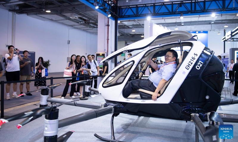 A visitor takes an electric aircraft at an exhibition of the 2024 Low Altitude Economic Development Conference in Wuhu, east China's Anhui Province, Sept. 6, 2024. Photo: Xinhua