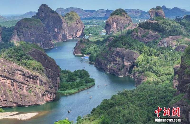 Arial view of Luxi River in Yingtan City, East China's Jiangxi Province on Sept. 7, 2024. The peaks of the Danxia landform, with their unique shapes, stand tall, while bamboo rafts drift on the azure waters, creating a picturesque scene. The Danxia landform in the Longhu Mountain Scenic Area of Yingtan City covers about 80 square kilometers. Photo: China News Service