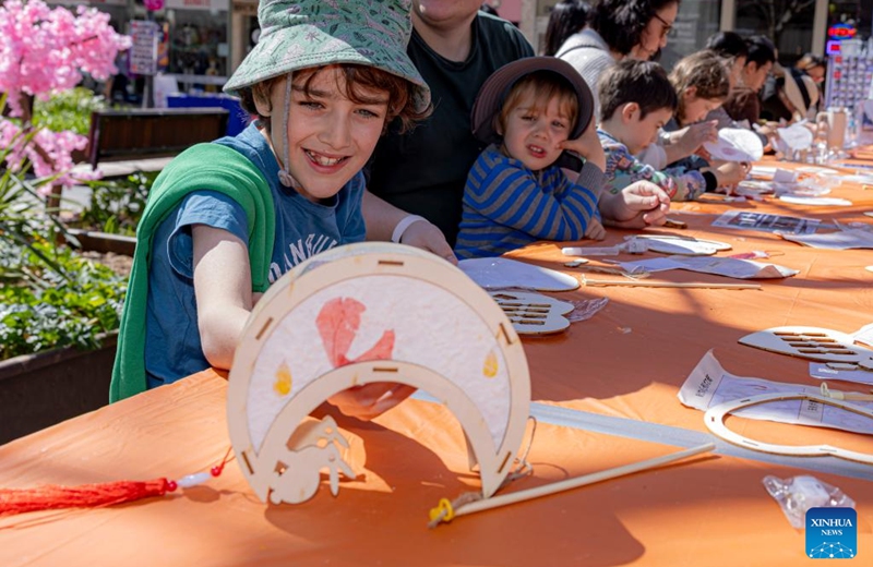 A boy shows a lantern made by himself during a celebration of the upcoming Mid-Autumn Festival in Canberra, Australia, Sept. 7, 2024. Photo: Xinhua