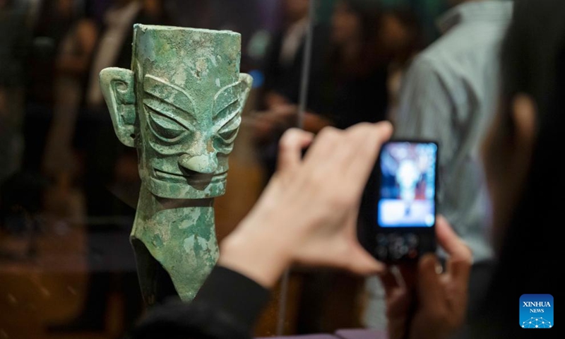 A visitor takes photos at an exhibition The Splendor of Chinese Bronzes: Masterpieces from the National Museum of China at Macao Museum of Art in Macao, south China, Sept. 6, 2024. The exhibition kicked off on Friday in Macao, showcasing more than 150 ancient bronzes from the collection of the National Museum of China. Photo: Xinhua