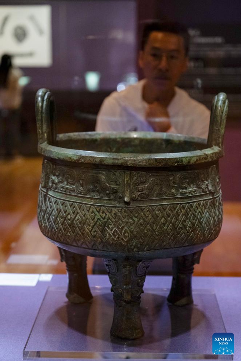 A visitor looks at an exhibit at an exhibition The Splendor of Chinese Bronzes: Masterpieces from the National Museum of China at Macao Museum of Art in Macao, south China, Sept. 6, 2024. The exhibition kicked off on Friday in Macao, showcasing more than 150 ancient bronzes from the collection of the National Museum of China. Photo: Xinhua