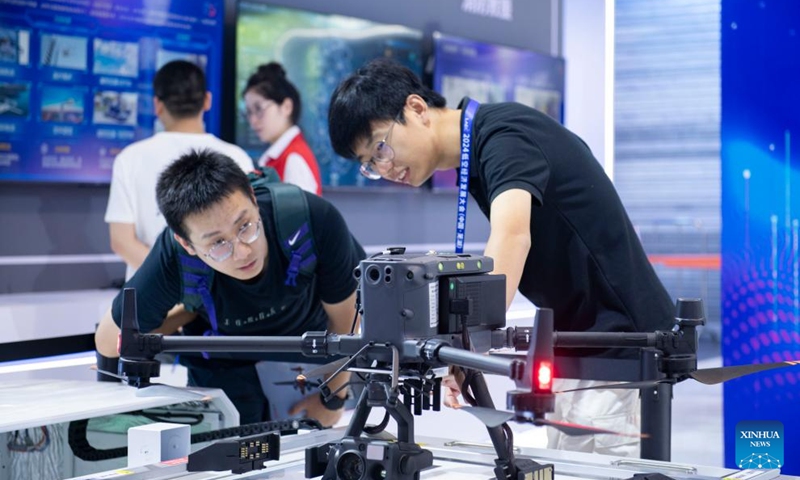 A visitor learns about an inspection drone at an exhibition of the 2024 Low Altitude Economic Development Conference in Wuhu, east China's Anhui Province, Sept. 6, 2024. Photo: Xinhua